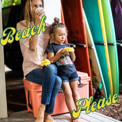 Beach Please! - mom and girl child enjoying snack sitting on Yeti cooler.