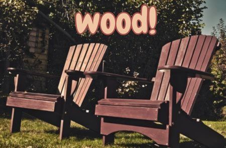 Two wood Adirondack chairs on lawn