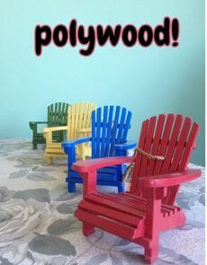 Red, blue, yellow, and green polywood Adirondack chairs displayed on a rug