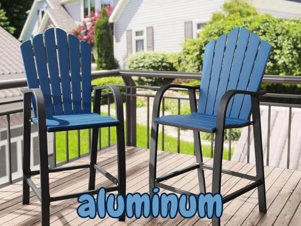 Pair of blue and black aluminum Adirondack chairs on balcony deck.
