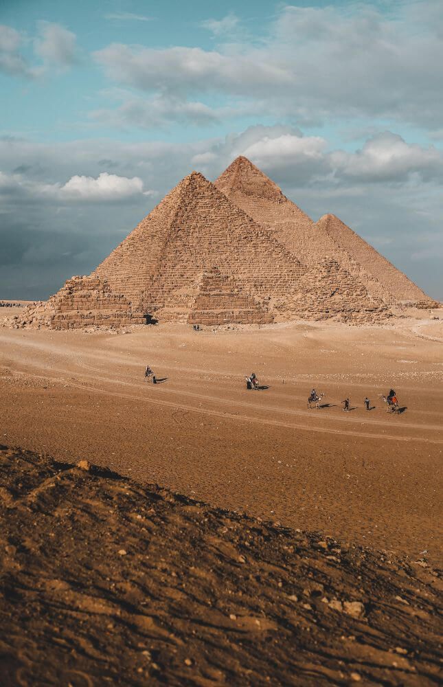 Pyramids and Travelers on Camels