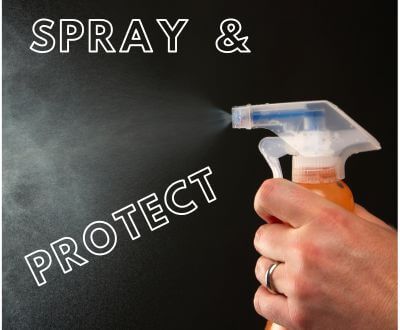 Sign saying "Spray & Protect" with spray bottle