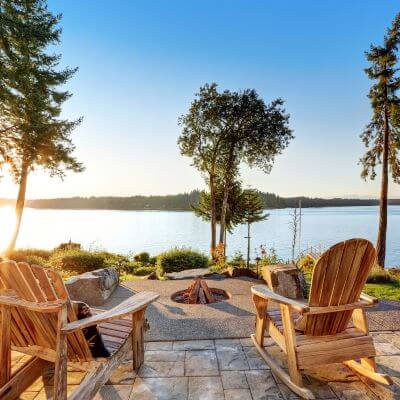 Relaxing scene with Adirondack chairs around a fire pit