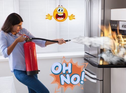 Woman with fire extinguisher putting out stove fire