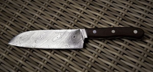 Damascus knife on wicker background
