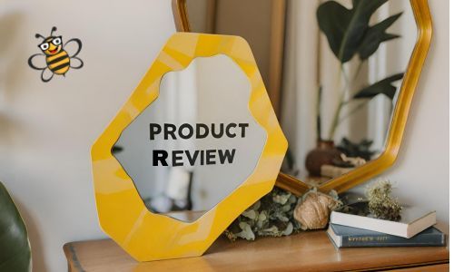 Product Review written on an asymmetrical mirror with Bertie Bee in corner