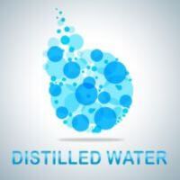 Image with "Distilled Water" under a magnified drop of water 
