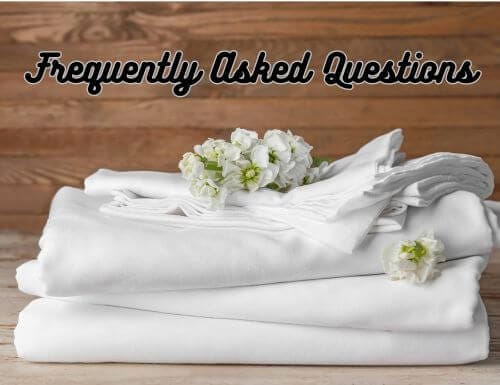 Frequently Asked Questions written over folded white sheet set