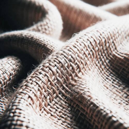 Close-up view of a linen sheet weave.