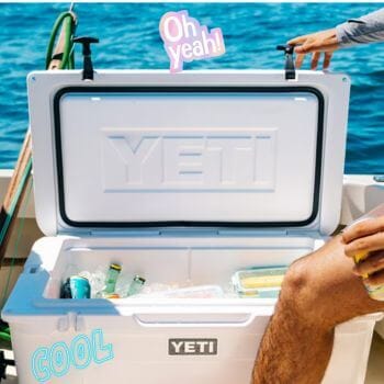 Man getting something out of open cooler on boat