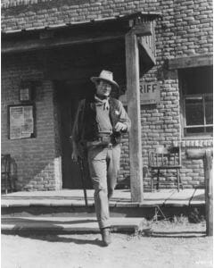 John Wayne on set of Rio Bravo (1959). Photo courtesy of the John Wayne Archive / Warner Bros.